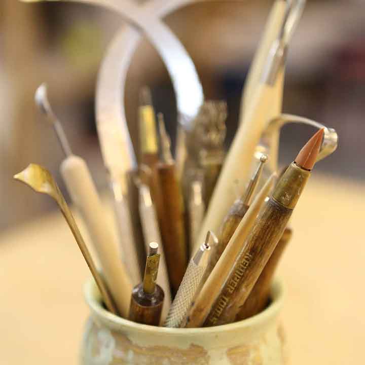 Image of a pot holding pottery tools