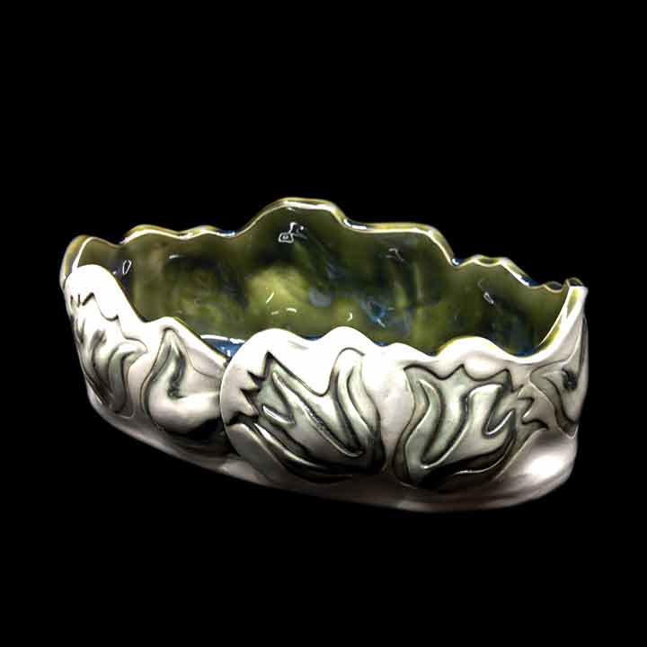 Simple pottery with beautiful fish artwork.