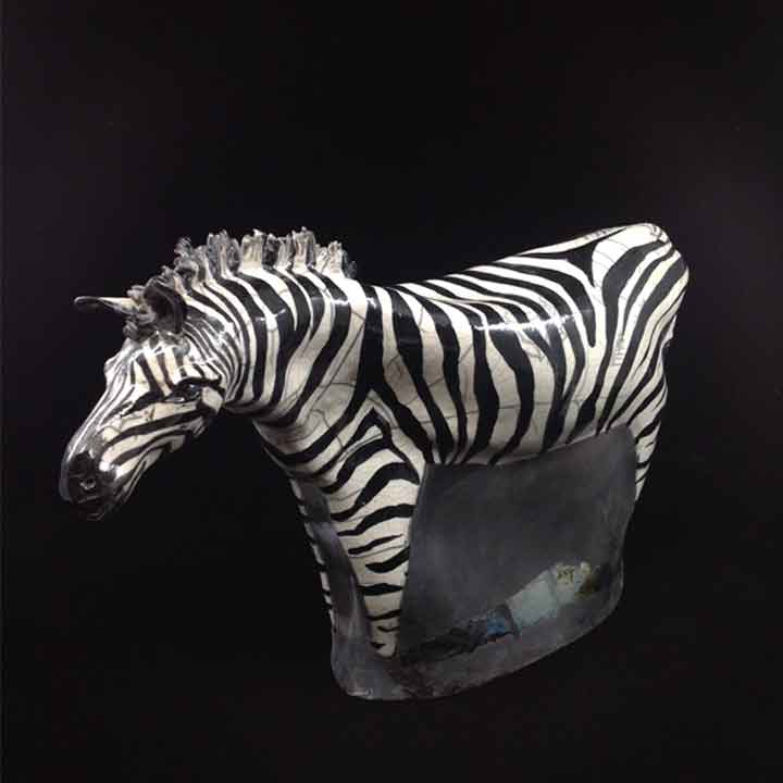 Creative bowl like sculpture with a shiny glaze.